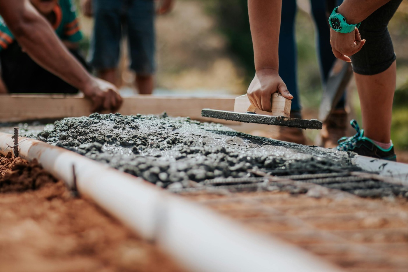Leveling fresh cement on a sunny day in Victor, Idaho